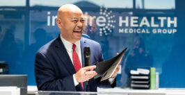 man speaking at a podium