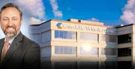 a man's portrait combined with a hospital building