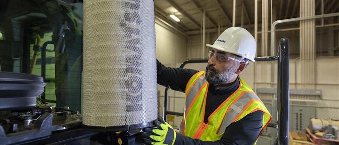 man working on a piece of heavy machinery