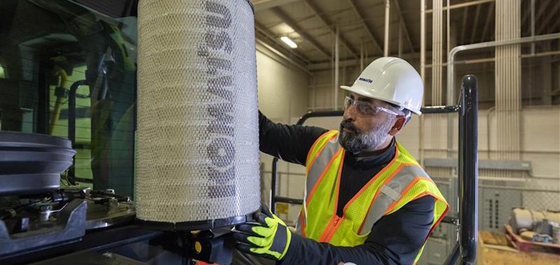 man working on a piece of heavy machinery