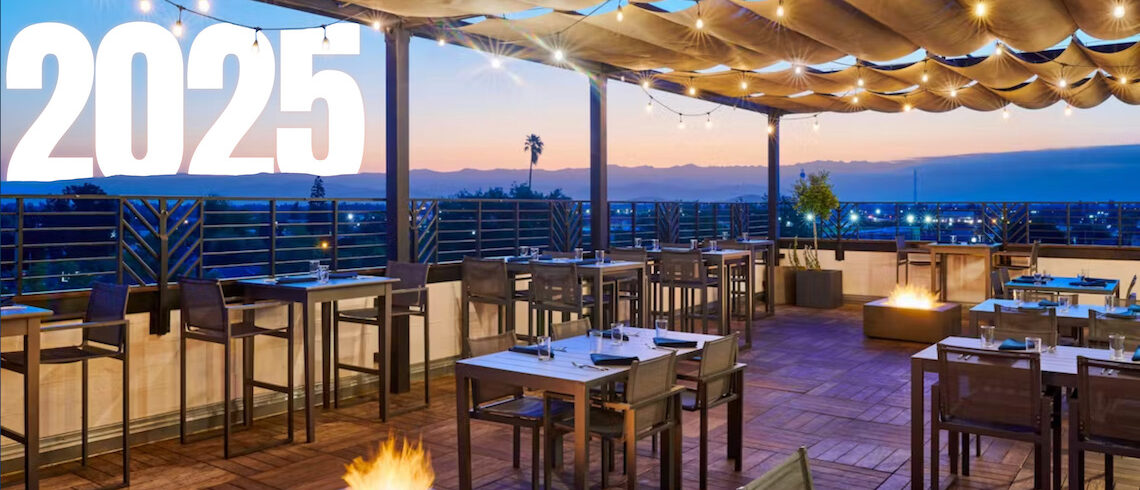a rooftop restaurant scene with a setting sun