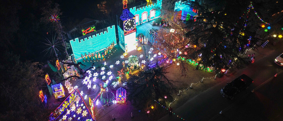 an aerial view of a home with an elaborate holiday light display