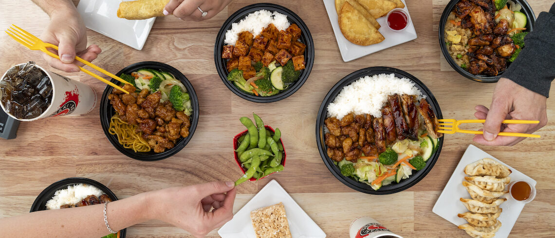 teriyaki spread of foods and a random ricke krispie treat.