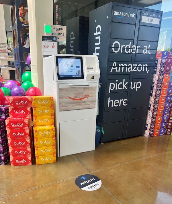 an amazon drop off kiosk in a save mart store next to a order pickup locker