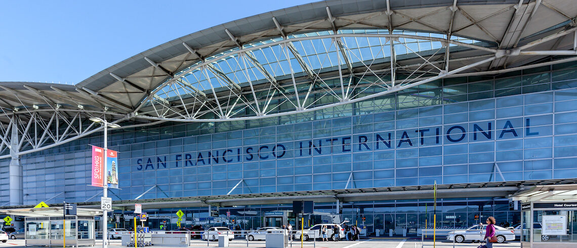 the front of an international airport that is modern