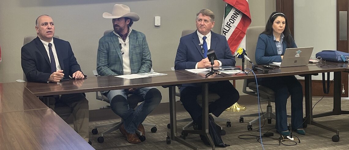 four speakers seated behind a desk