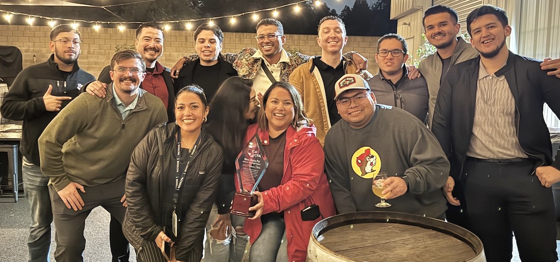 group of people posed at a pub