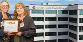 hospital graphic with a woman receiving a plaque