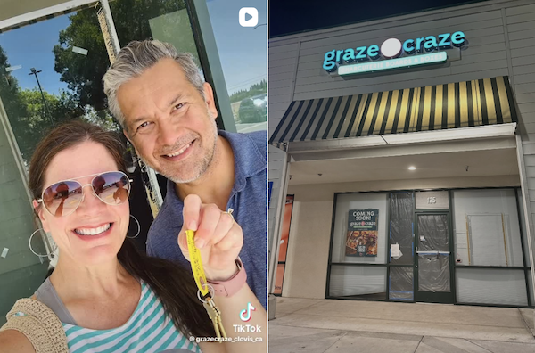 smiling couple and building storefront