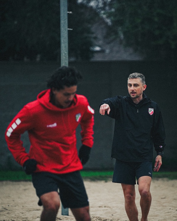 soccer coach directing player