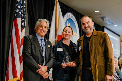 three people posing for a photo