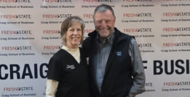 two people in front of a backdrop