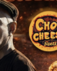 man next to a chop cheese bodega logo