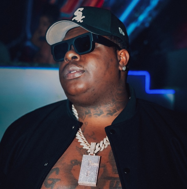 a man with sunglasses and a baseball cap