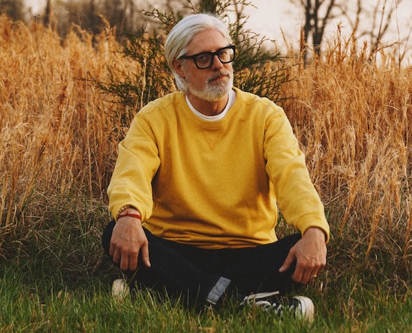 man sitting in a field