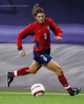 woman dribbling soccer ball
