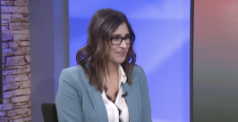 woman seated in an interview