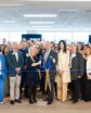 large gather of people for an office ribbon cutting