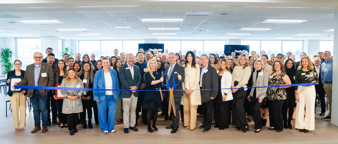 large gather of people for an office ribbon cutting