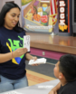 Teaching Fellow working with student