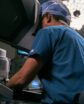 surgeon performing robotic surgery