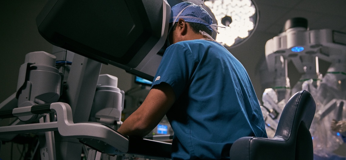 surgeon performing robotic surgery