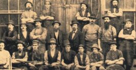 black and white image of men circa 1860s in victorian dress