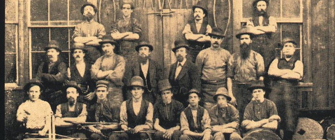 black and white image of men circa 1860s in victorian dress