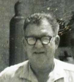 black and white photo of a man wearing glasses