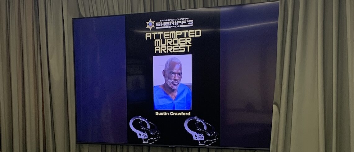 man's mugshot on a television screen