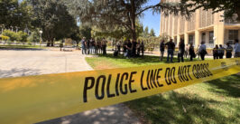 Yellow law enforcement tape cordons off a section of Courthouse Park in Downtown Fresno.