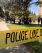 Yellow law enforcement tape cordons off a section of Courthouse Park in Downtown Fresno.