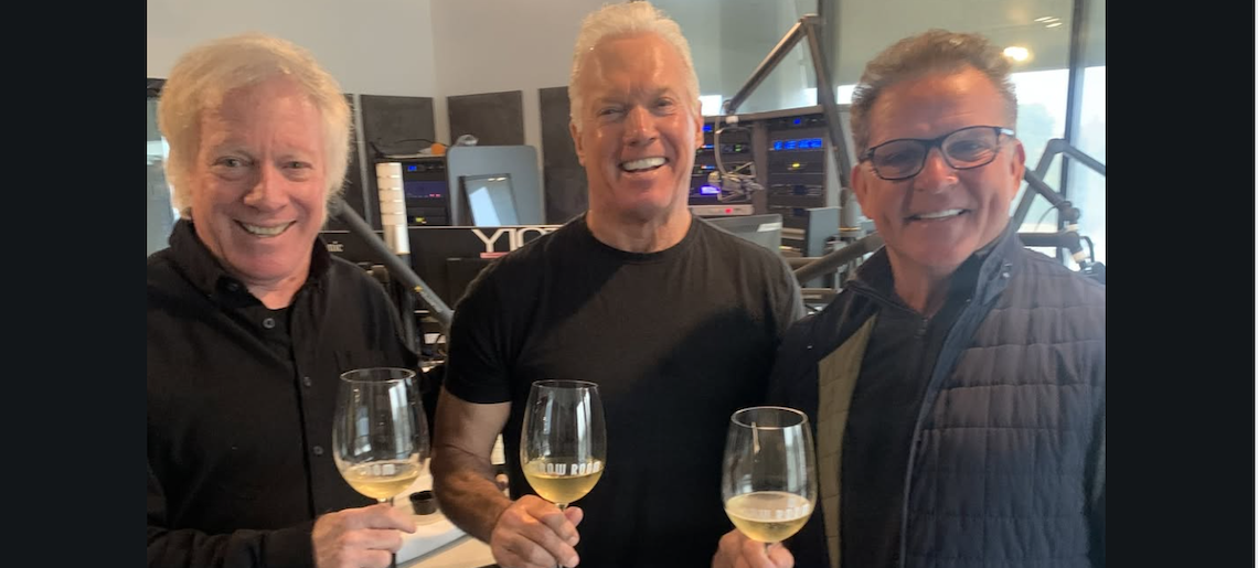 three men toasting with wine