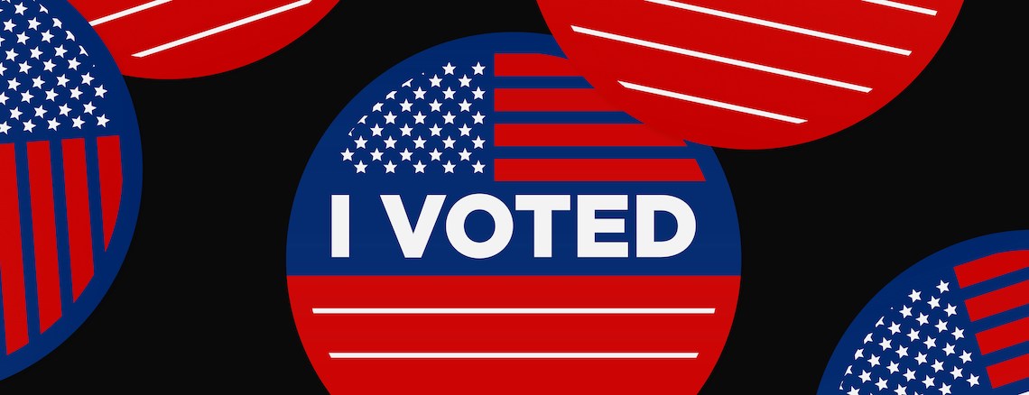 A visual of 'I Voted' stickers against a black background