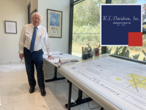 R.L. Davidson founder Robert Davidson stands beside architectural plans in the firm’s Clovis office.