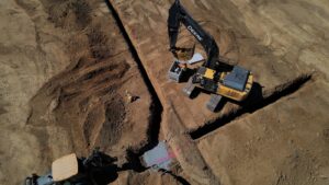 trench digging on a construction site with machinery