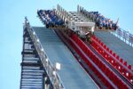 Riders crest a hill on the X2 roller coaster at Six Flags Magic Mountain.