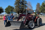 person sitting on a tractor