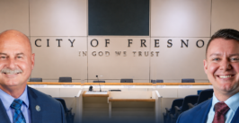 council dais and two men's headshots