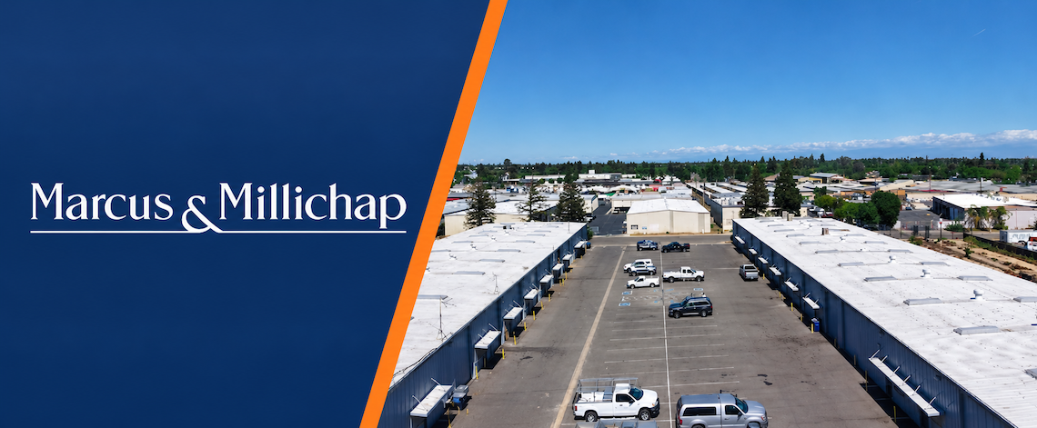 a company logo and aerial view of an industrial complex