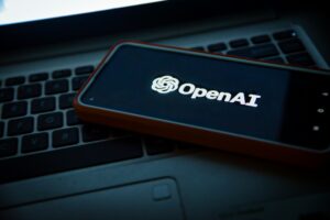 a cell phone with the openai logo