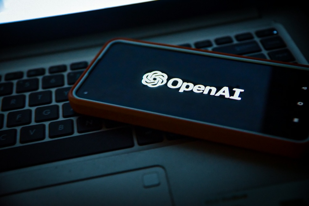 a cell phone with the openai logo