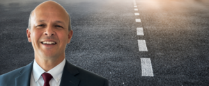 a street and a man's headshot