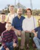 family photo with a mother, father and four children