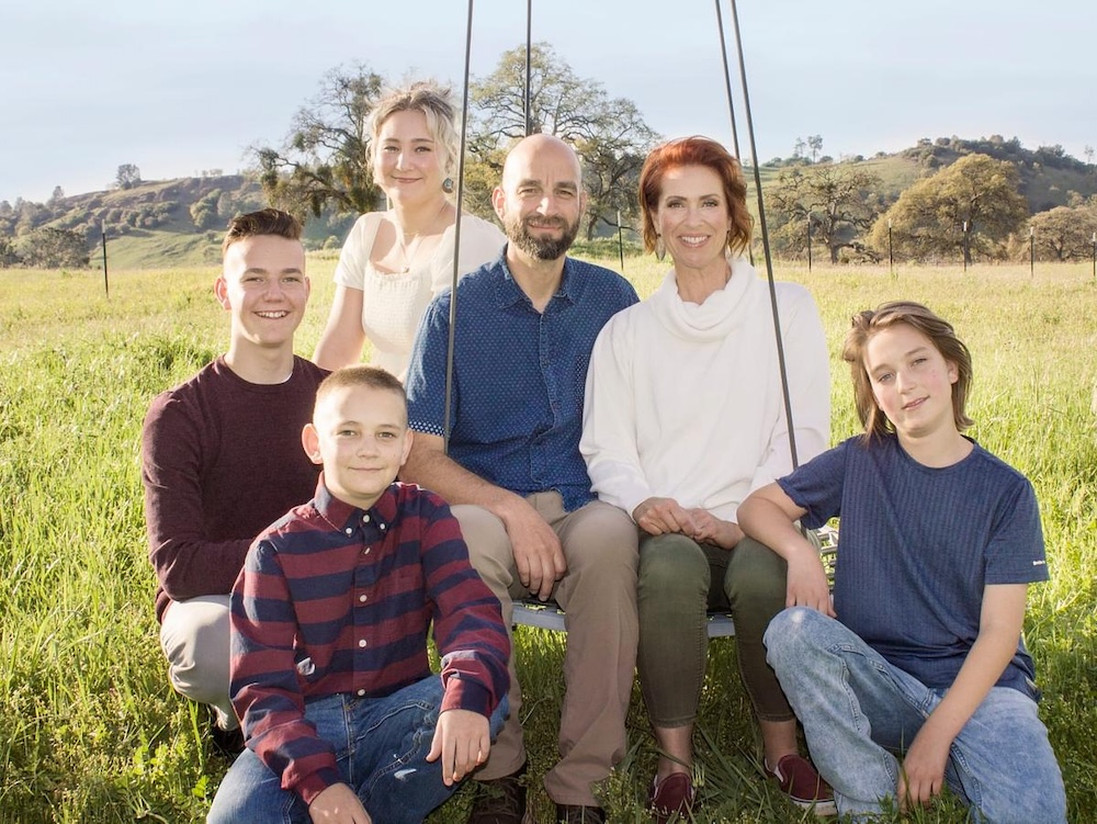 family photo with a mother, father and four children