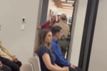 a person being removed from a meeting