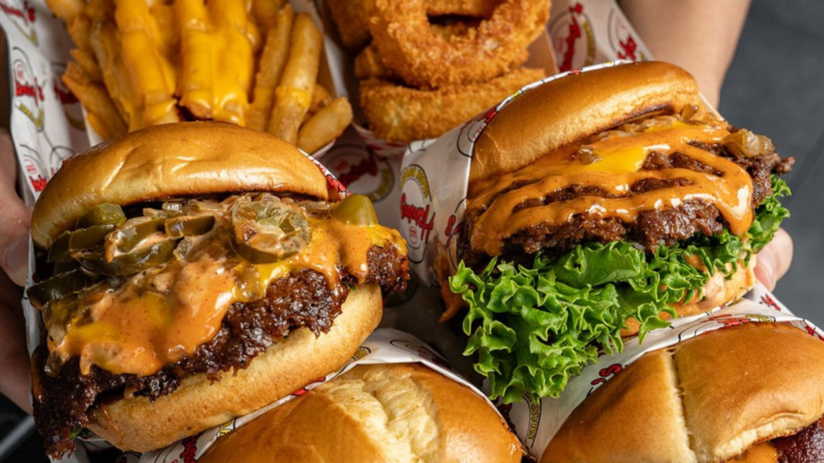 Three Hammy’s smash burgers with cheese, bacon and lettuce, served with fries.