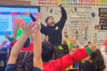 a person leading a dancing exercise with children