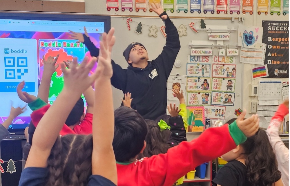 a person leading a dancing exercise with children