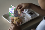 child eating a school lunch